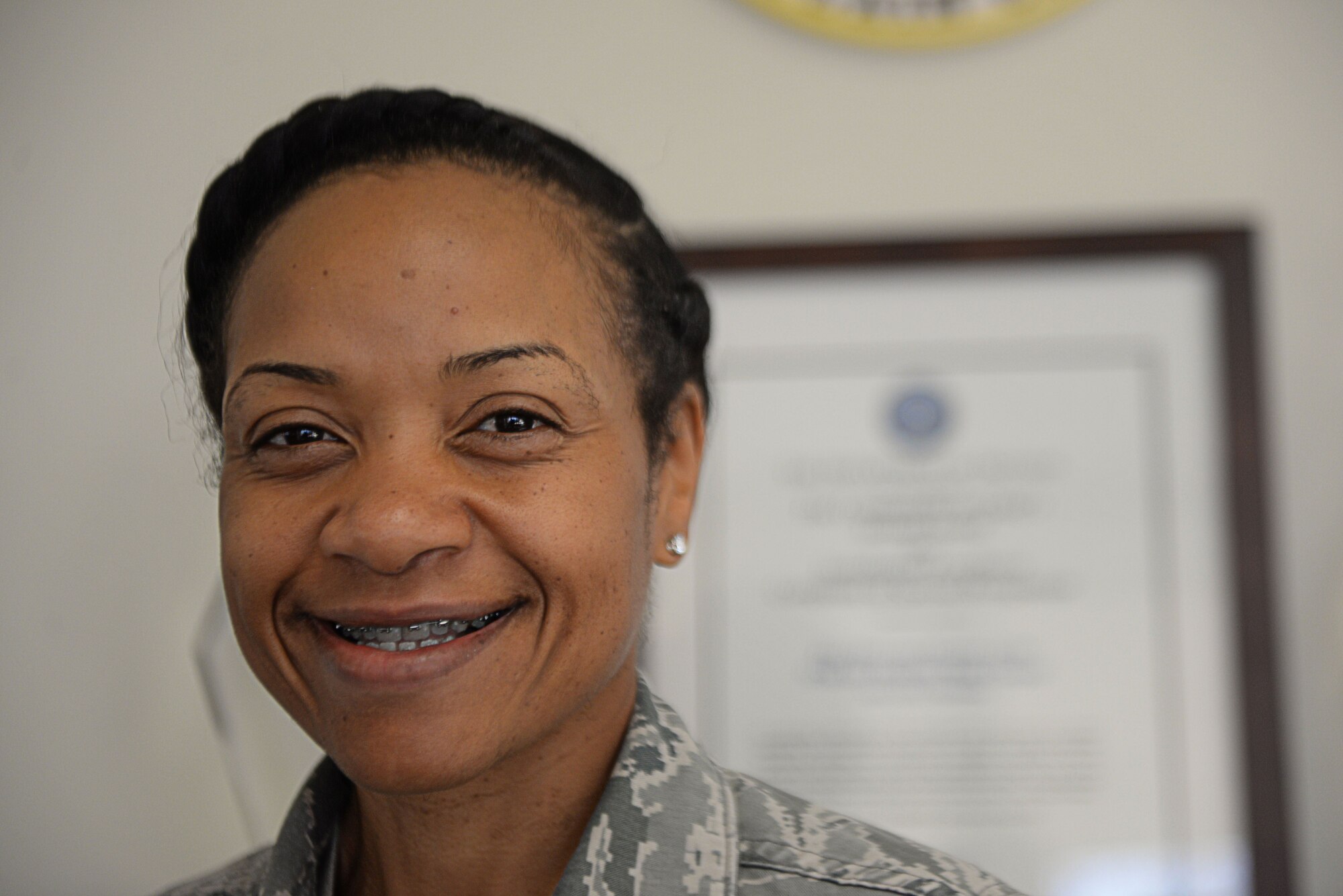 Chaplain (Capt.) Quanika Bynum, a chaplain assigned to the 97th Air Mobility Wing, stands in front of the chapel entrance February 2, 2018, Altus Air Force Base, Okla.