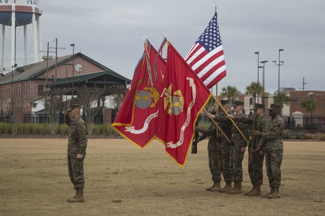 Sgt. Maj. Patrick J. Kimble, force sergeant major of Marine Forces Reserve and Marine Forces North, salutes as colors are presented during his relief and appointment ceremony held at Marine Corps Support Facility, New Orleans, Louisiana, Feb. 2, 2018. Kimble relinquished his duties to Sgt. Maj. Scott D. Grade, who will post as the new force sergeant major for MARFORRES and MARFORNORTH. (U.S. Marine Corps Photograph by Lance Cpl. Ricardo Davila/Released)