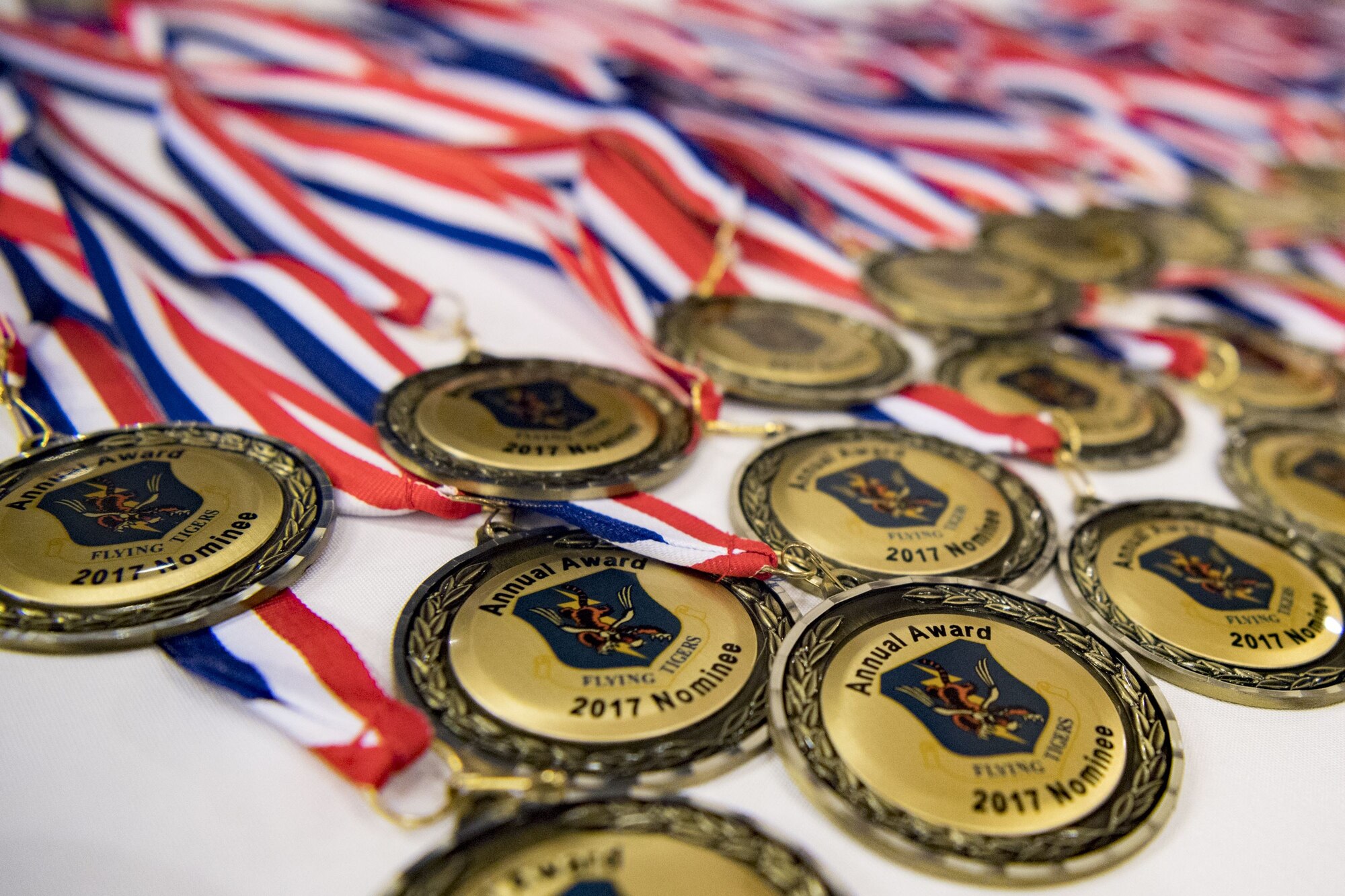 Medallions sit on a table before a Tour of Champions, Feb. 2, 2018, at Moody Air Force Base, Ga. The Tour of Champions recognizes 23d Wing annual award nominees and an opportunity to gain a better perspective of the 23d Wing’s mission. (U.S. Air Force photo by Senior Airman Daniel Snider)