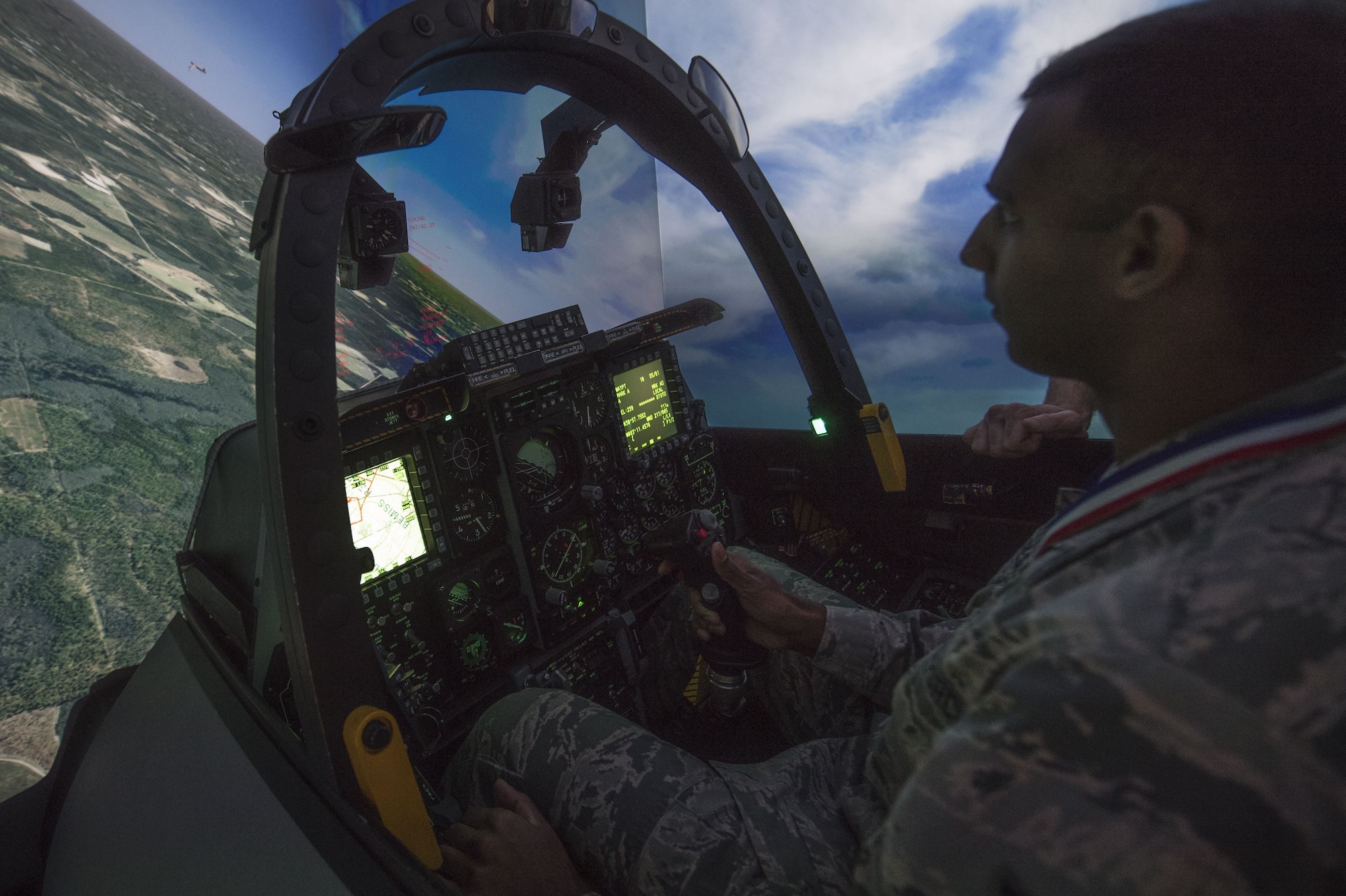 Senior Airman Andrew Soarez, 23d Medical Support Squadron medical laboratory technician, flies in an A-10C Thunderbolt II simulator during a Tour of Champions, Feb. 2, 2018, at Moody Air Force Base, Ga. The Tour of Champions recognizes 23d Wing annual award nominees and an opportunity to gain a better perspective of the 23d Wing’s mission. (U.S. Air Force photo by Senior Airman Daniel Snider)