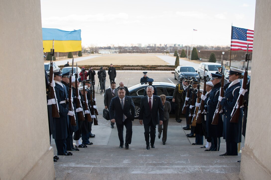 Defense Secretary James N. Mattis walks with Ukrainian Defense Minister Stepan Poltorak past troops and into the Pentagon.