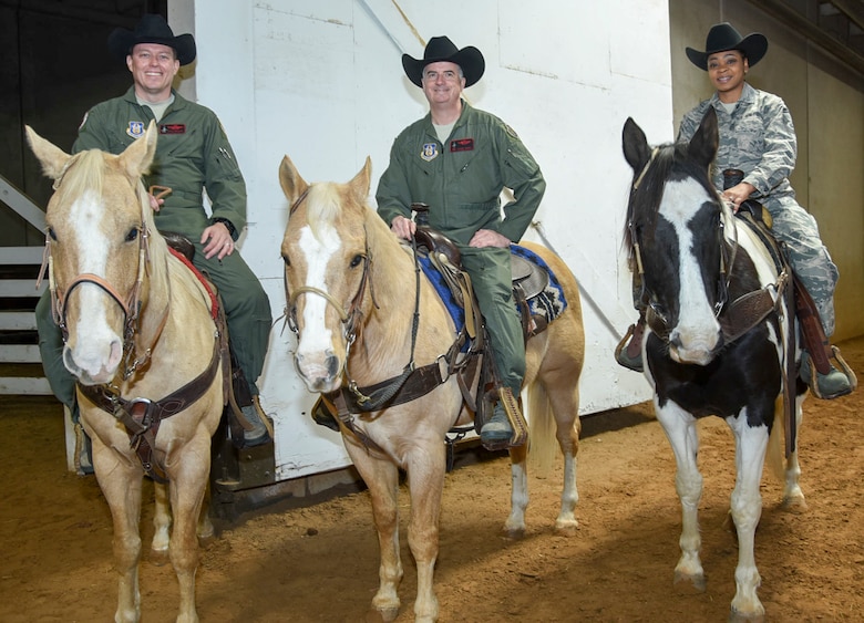 Col. Mitch Hanson, 301st Fighter Wing vice commander, Col. Gregory Jones, 301 FW commander, and Senior Master Sgt. Natalie Hunter, 301st Logistics Readiness Squadron’s logistics supply manager, rest their horses before riding in the Fort Worth Stock Show and Rodeo's Grand Entry during Military Appreciation Day at Will Rogers Coliseum in Fort Worth, Texas, January 29, 2018. As this rodeo celebrates their centennial year as the world's first-ever indoor rodeo, the Air Force Reserve will celebrate their 70th birthday on April 14, 2018. (U.S. Air Force photo by Ms. Julie Briden-Garcia)