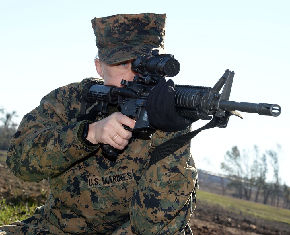 SSgt. Rebekah Nelson, contract specialist, Contracting, Marine Corps Logistics Command, sights in her M4 rifle during grass week aboard Marine Corps Logistics Base Albany, Jan. 31. Grass week helps Marines refamiliarize themselves with shooting positions and weapon safety before qualifying on the rifle range at Marine Corps Recruit Depot, Parris Island, S.C. Every Marine is a rifleman and must pass the annual requirement.
