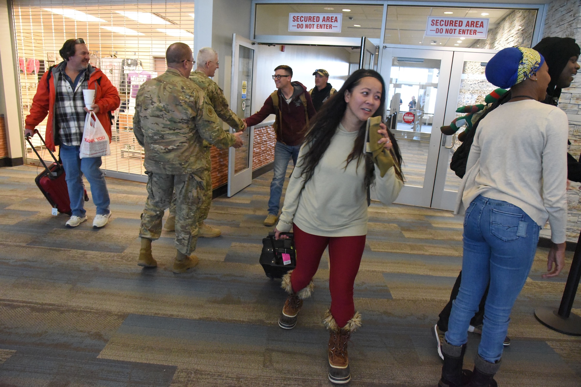 Twelve members of the 219th Security Forces Squadron returned home to the Minot International Airport, Minot, N.D., upon completion of their six-month deployment to southwest Asia Feb. 2, 2018.