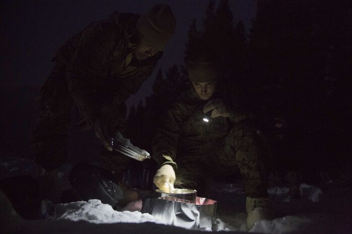 Marines with Task Force Arctic Edge boil snow into water to replenish reserves during a cold weather training exercise at Marine Corps Mountain Warfare Training Center, Bridgeport, Calif., Jan. 27, 2018. Approximately 90 Marines participated in the week-long event where they learned survival skills, how to traverse mountainous terrain and cold weather weapons maintenance. The training will prepare the Marines for joint-force training exercise Artic Edge in northern Alaska, which will expose Marines to the peninsula’s weather extremes. (U.S. Marine Corps photo by Sgt. Brianna Gaudi)