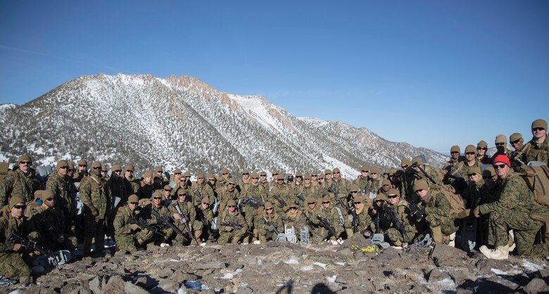 Marines with Combat Logistics Regiment 25, 2nd Marine Logistics Group pose for a group photo cold weather training at Marine Corps Mountain Warfare Training Center, Bridgeport, Calif., Jan. 28, 2018. Approximately 90 Marines participated in the week-long event where they learned survival skills, how to traverse mountainous terrain and cold weather weapons maintenance. The training will prepare the Marines for joint-force training exercise Artic Edge in northern Alaska, which will expose Marines to the peninsula’s weather extremes. (U.S. Marine Corps photo by Sgt. Brianna Gaudi)