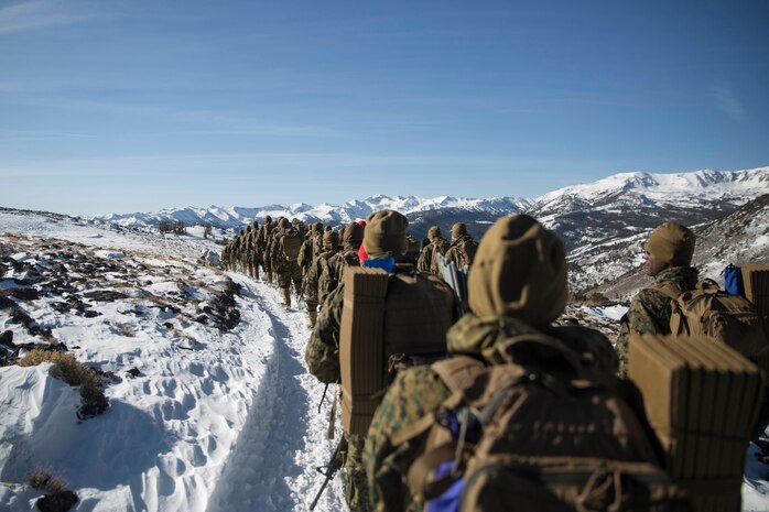 Marines with Combat Logistics Regiment 25, 2nd Marine Logistics Group traverse the snow-covered Sierra Nevada Mountains during cold weather training at Marine Corps Mountain Warfare Training Center, Bridgeport, Calif., Jan. 28, 2018. Approximately 90 Marines participated in the week-long event where they learned survival skills, how to traverse mountainous terrain and cold weather weapons maintenance. The training will prepare the Marines for joint-force training exercise Artic Edge in northern Alaska, which will expose Marines to the peninsula’s weather extremes. (U.S. Marine Corps photo by Sgt. Brianna Gaudi)