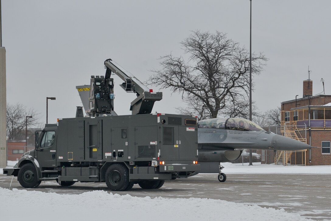 An F-16 with actress Elizabeth Banks in the passenger seat and Maj. John Waters piloting is de-iced at the Minneapolis-St. Paul Air Reserve Station, Minn., Feb 3, 2018.  Waters is part of the Viper Demo Team performing the Air Force Heritage Flight flyover for Super Bowl LII.(U.S. Air Force photo by Master Sgt. Eric Amidon)