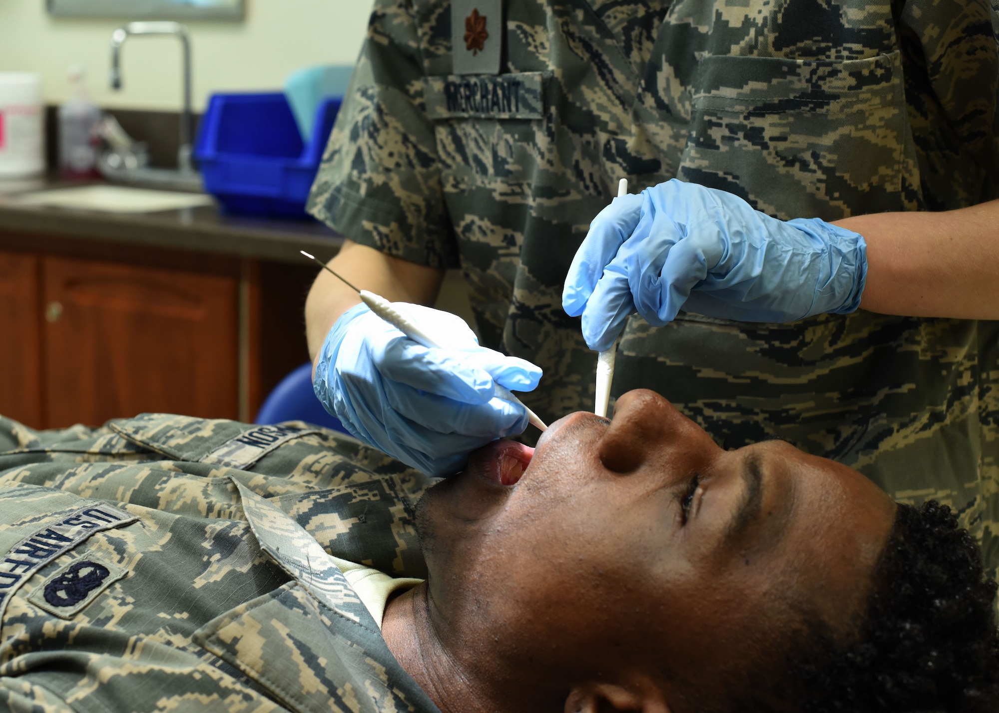 Air Force Maj. Lindsey Merchant, 301st Medical Squadron dentist, performs a dental exam for a patient in an exam room, Feb. 3, 2018, at Naval Air Station Fort Worth Joint Reserve Base, Texas. Merchant has been a dentist for the Air Force since her graduation from dental school in 2010. (U.S. Air Force photo by Senior Airman Katherine Miller)