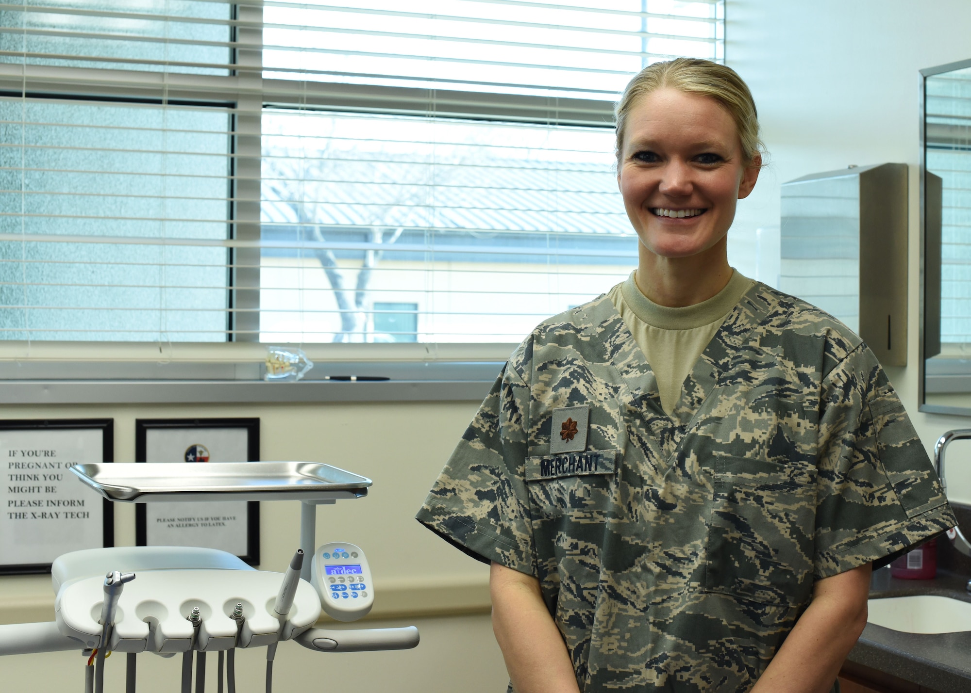 Maj. Lindsey Merchant, 301st Medical Squadron dentist, stands with her dental equipment at the squadron, Feb. 3, 2018, at Naval Air Station Fort Worth Joint Reserve Base, Texas. The dental clinic here provides Airmen with dental exams to assist in keeping them mission ready and deployable. (U.S. Air Force photo by Senior Airman Katherine Miller)