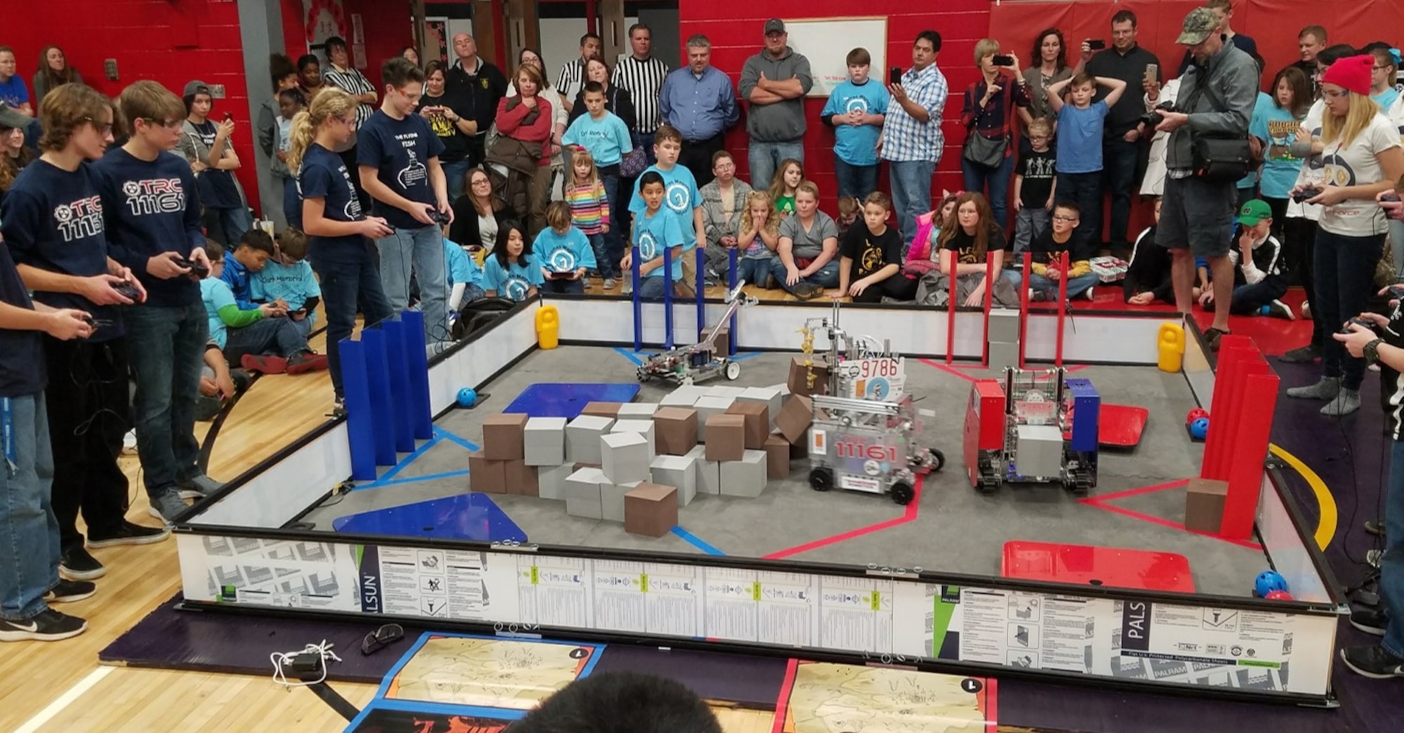 As the FIRST® LEGO® League (FLL) Qualifying Tournament judges deliberate over the final scores, four of six FIRST® Tech Challenge Teams sponsored by the Arnold STEM program put on a scrimmage with the robots they’ve programmed to compete at the high school level. (Courtesy photo)