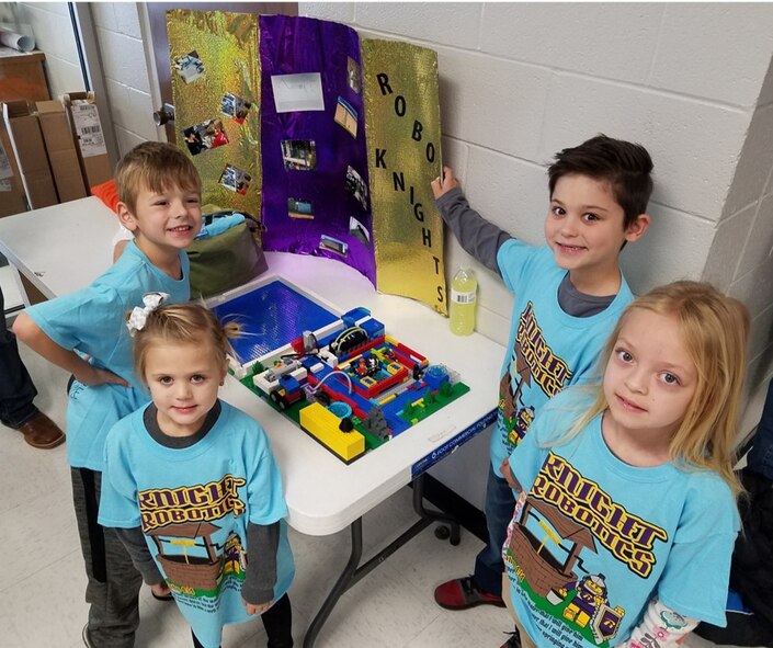 These elementary students participate as  FIRST® LEGO® League Junior Teams at the FIRST® LEGO® League (FLL) Qualifying Tournament held Dec. 9 in Manchester. To prepare for the competitions, students research a real-world problem, such as food safety, recycling or energy, and then develop a solution and present their results. (Courtesy photos)