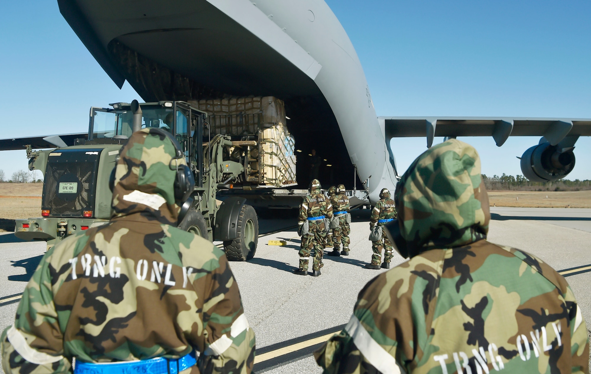 U.S. Air Force Airmen of the 321st Contingency Response Squadron, 621st Contingency Response Wing, Joint Base McGuire-Dix-Lakehurst, New Jersey, load cargo onto a C-17 Globemaster III assigned to the 437th Airlift Wing as part of Exercise Crescent Moon Jan. 30, at Joint Base Charleston’s North Auxiliary Airfield near Orangeburg, South Carolina.