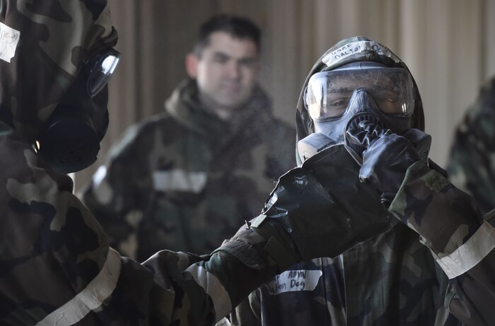 Airmen from the 321st Contingency Response Squadron, 621st Contingency Response Wing, Joint Base McGuire-Dix-Lakehurst, New Jersey, practice chemical, biological, radiological and nuclear defense techniques during Exercise Crescent Moon Jan. 30, at Joint Base Charleston’s North Auxiliary Airfield near Orangeburg, South Carolina.