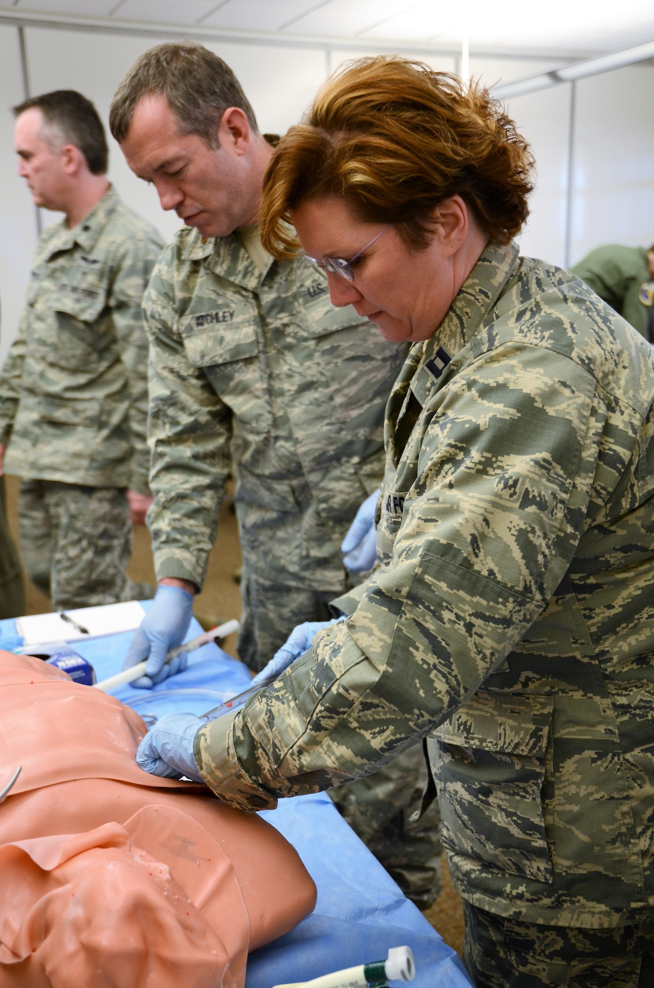 U.S. Air Force Capt. Frances Burress, with the 116th Medical Group (MDG), Georgia Air National Guard, places a chest tube during the thoracic trauma skills station of Advanced Trauma Life Support training at Nellis Air Force Base, Nev., Jan. 26, 2018.