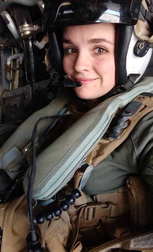 U.S. Marine Cpl. Karissa Tanguay-Jones, a native of Colorado Springs, Colorado, sits in the back of an MV-22 Osprey during a recent training flight in California. Tanguay-Jones stars in "A Nation's Call," the latest advertisement released under the Marine Corps' “Battles Won” strategy. The commercial unfolds by showcasing the full power of the United States Marine Corps engaged in an assault mission. Depicting a 5th Generation Marine Corps operation (naval integration, ship-to-objective, technology-fueled). As the Marines move toward the objective, each layer of ships, tanks, armored vehicles, planes and helicopters is removed. This visual story, in combination with the voiceover, will communicate and emphasize to the audience that, when the Nation faces any battle, the Marines themselves—with their fighting spirit—are the greatest weapon in the United States Marine Corps’ arsenal.