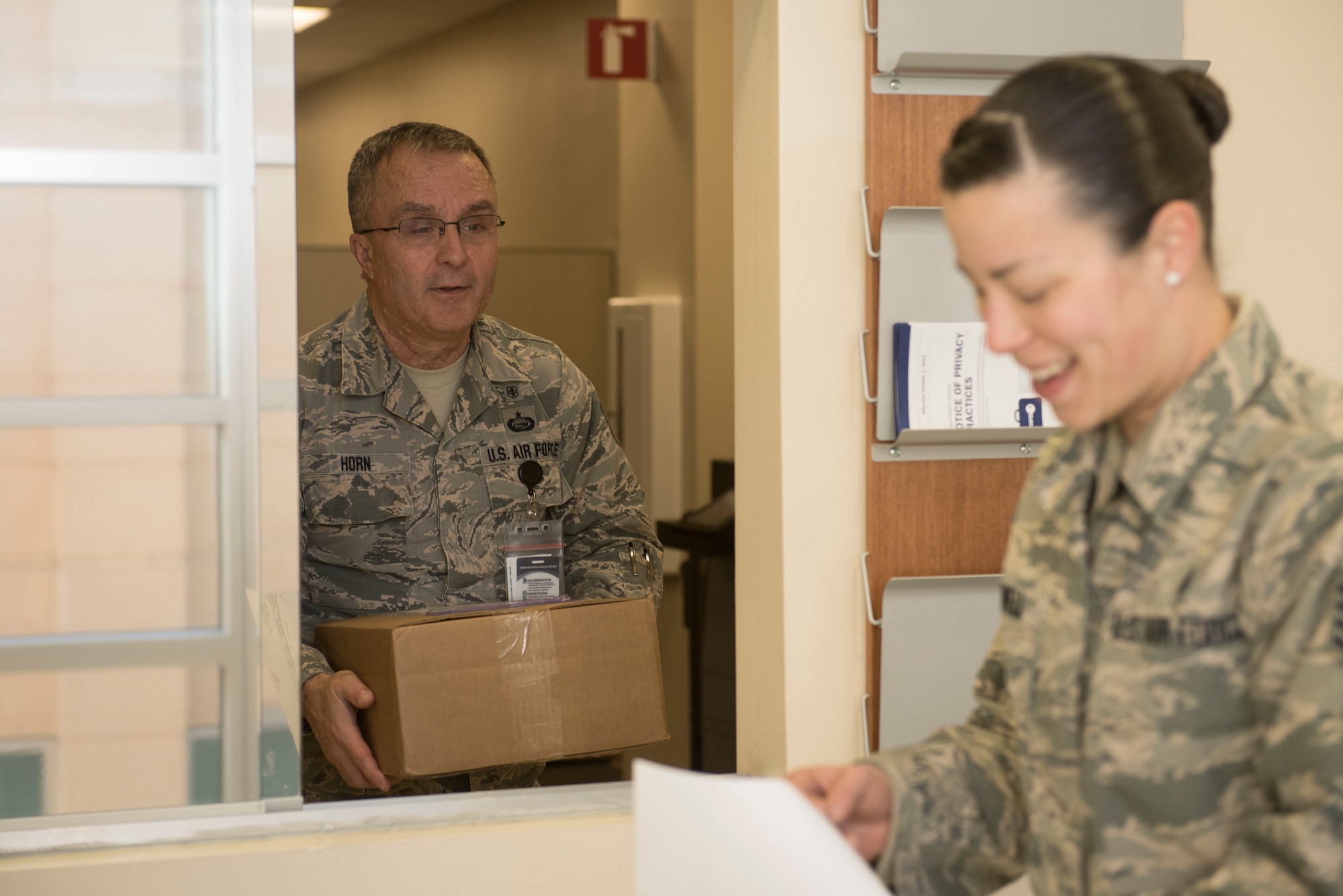 U.S. Air Force Tech. Sgt. Kenneth Horn, 20th Medical Support Squadron (MDSS) outpatient record noncommissioned officer in charge (NCOIC), left, thanks Staff Sgt. Melanie Bedwell, 20th MDSS storage and distribution NCOIC, after receiving his shop’s supplies at Shaw Air Force Base, S.C., Jan. 31, 2018.