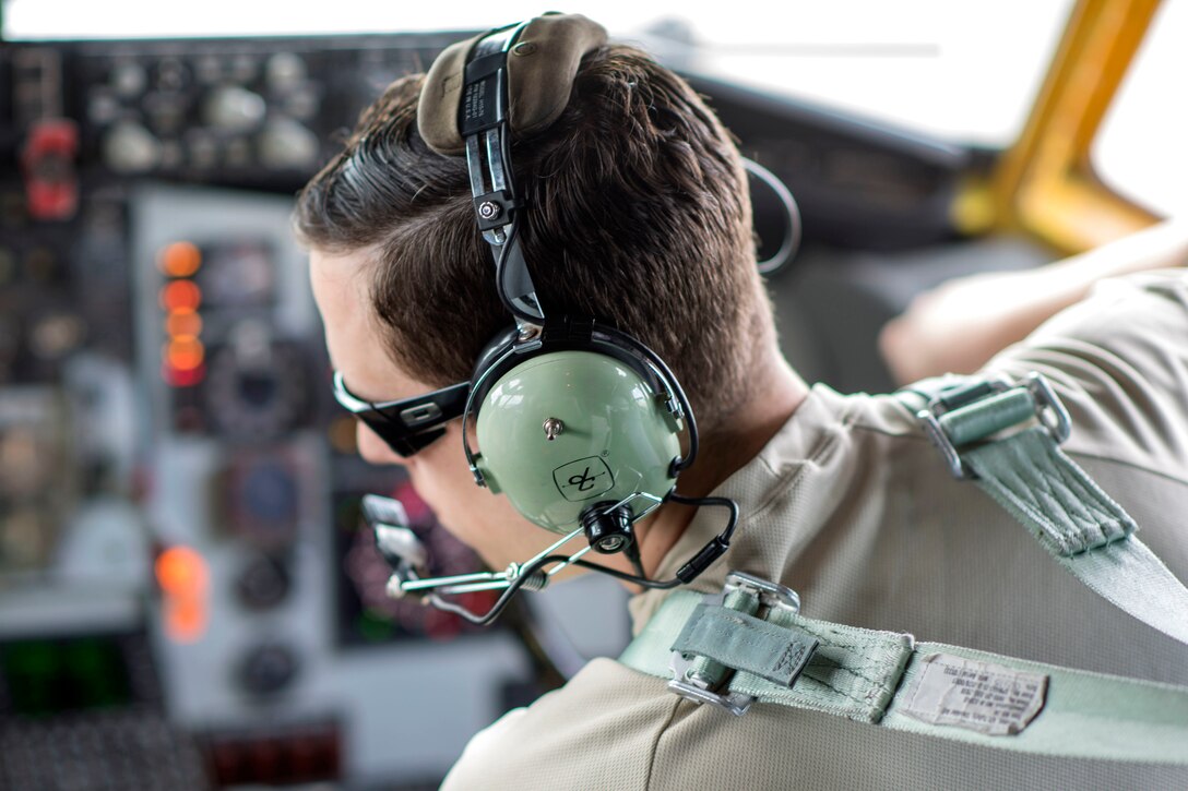An airman sits in the cockpit of a KC-135R Stratotanker.
