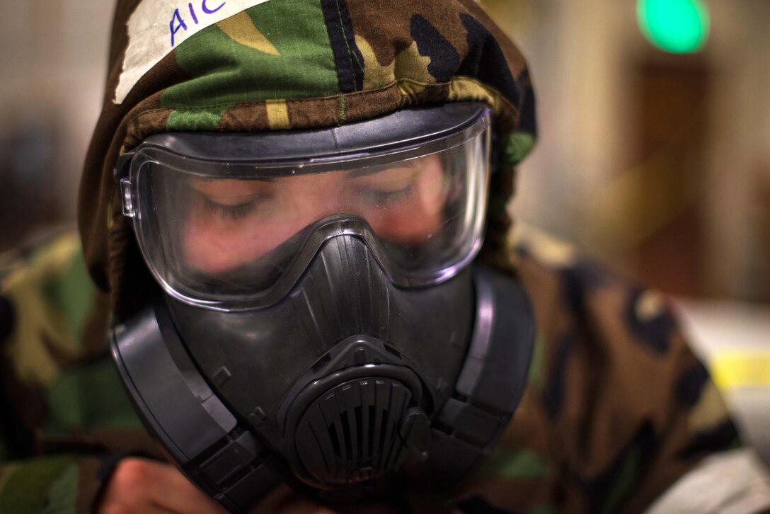 An airman wears a face mask.