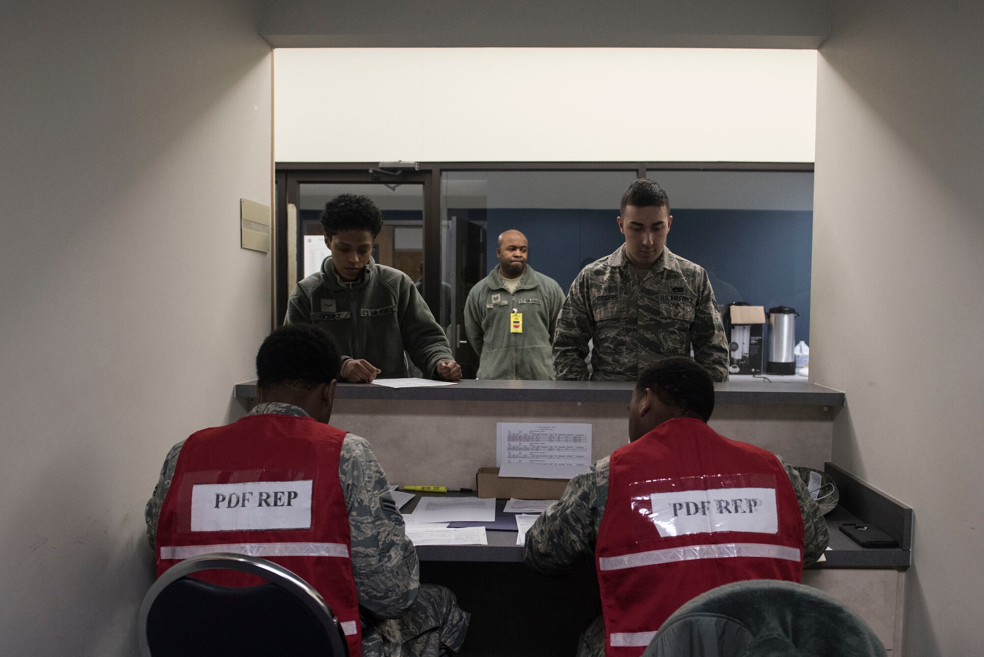 U.S. Airmen speak to pre-deployment line representatives during a Phase I exercise at Shaw Air Force Base, S.C., Feb. 4, 2018.