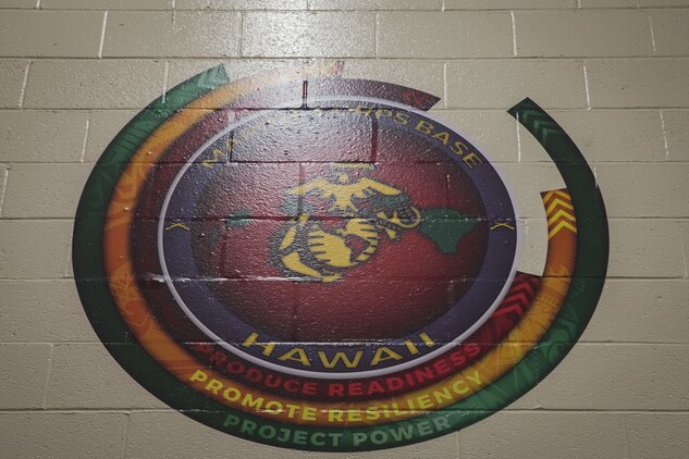The Marine Corps Base Hawaii logo is printed onto the wall of the base's Semper Fit High-Intensity Tactical Training (HITT) Center, Feb. 2, 2018. The newly remodeled HITT Center and Fitness Center feature new equipment, flooring, and infrastructure designed to ensure that Marines aboard the installation can produce readiness by being able to better ready themselves for the challenges of the modern warfighter. (U.S. Marine Corps photo by Sgt. Alex Kouns)
