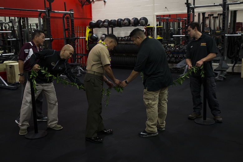 U.S. Marine Corps Col. Raul Lianez, commanding officer, Marine Corps Base Hawaii, along with Semper Fit staff reopen the base's Semper Fit High-Intensity Tactical Training (HITT) Center, Feb. 2, 2018. The newly remodeled HITT Center and Fitness Center feature new equipment, flooring, and infrastructure designed to ensure that Marines aboard the installation can produce readiness by being able to better ready themselves for the challenges of the modern warfighter. (U.S. Marine Corps photo by Sgt. Alex Kouns)