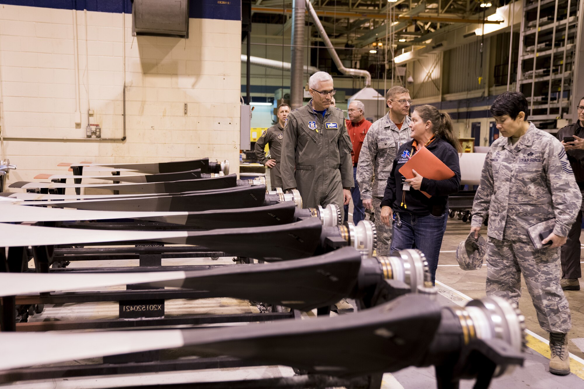 Robin Hamsley, center, leads Maj. Gen. Craig La Fave, 22nd Air Force commander, and Chief Master Sgt. Imelda Johnson, 22nd AF command chief, on a tour of the 402nd Commodities Maintenance Group facility Feb. 2, 2018, at Robins Air Force Base, Georgia. The 402nd CMXG provides depot maintenance support to F-15, C-5 and C-130 aircraft flown and tested by the 413th Flight Test Group and 339th Flight Test Squadron. Hamsley is a director assigned to the 572nd Aircraft Component Repair Squadron. (U.S. Air Force photo by Jamal D. Sutter)
