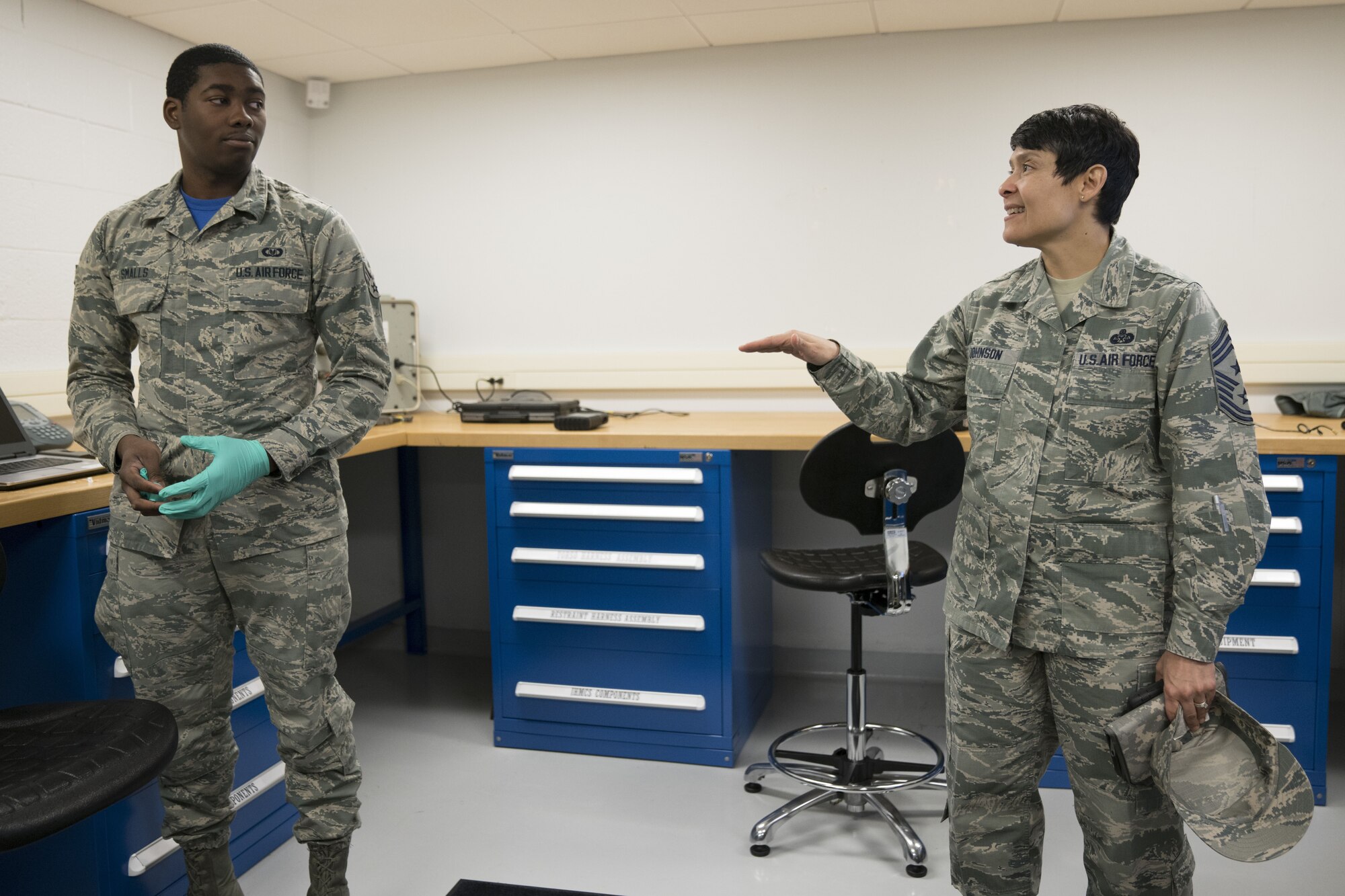 Chief Master Sgt. Imelda Johnson, 22nd Air Force command chief, discusses career progression with Senior Airman Khalil Smalls, 339th Flight Test Squadron aircrew flight equipment helper, Feb. 2, 2018, at Robins Air Force Base, Georgia. Smalls is the lowest ranking individual in his unit and will soon begin Airman Leadership School, the first level of the Enlisted Professional Military Education. (U.S. Air Force photo by Jamal D. Sutter)