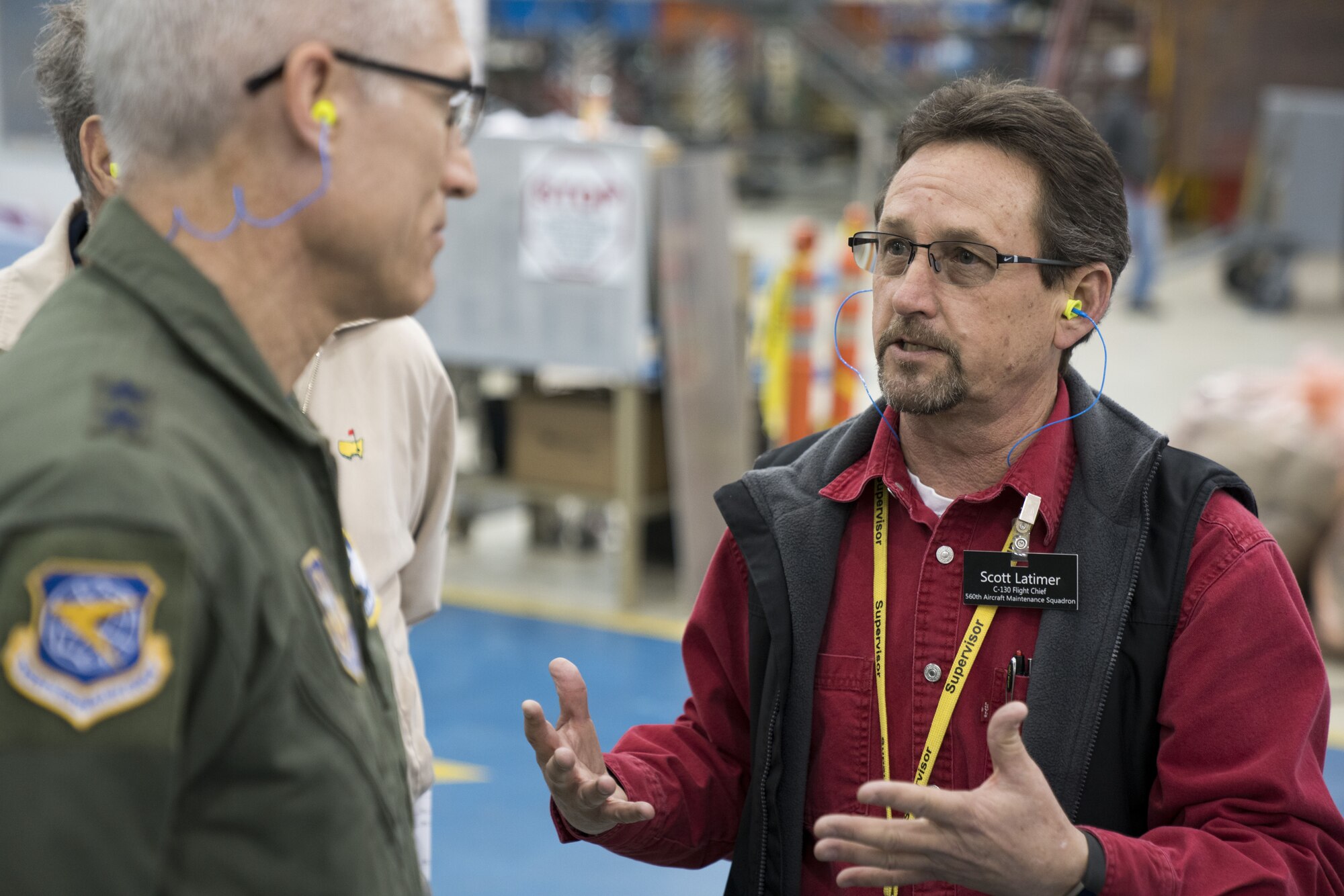 Scott Latimer, 560th Aircraft Maintenance Squadron C-130 flight chief, briefs Maj. Gen. Craig La Fave, 22nd Air Force commander, on C-130 programmed depot maintenance Feb. 2, 2018, at Robins Air Force Base, Georgia. PDM is the process of periodic inspection and repair of aircraft structural elements. (U.S. Air Force photo by Jamal D. Sutter)