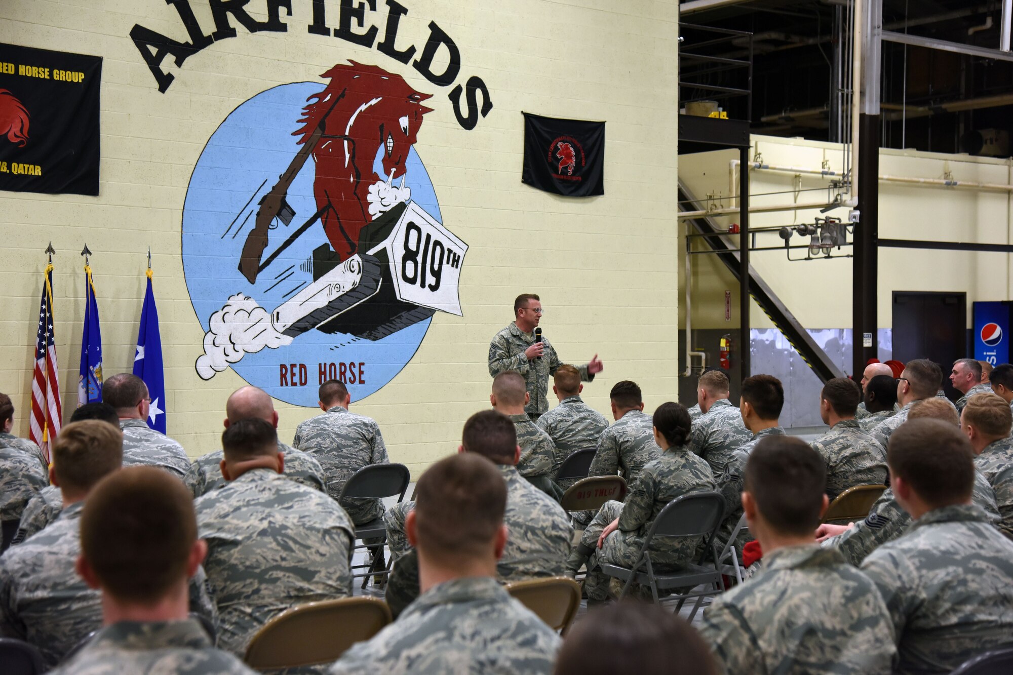 U.S. Air Force Chief Master Sgt. David W. Wade, 9th Air Force command chief, addresses members of the Rapid Engineer Deployable Heavy Operational Repair Squadron Engineers (RED HORSE) during a commander’s call at Malmstrom Air Force Base, Mont., Jan. 25, 2018. During their visit, 9th AF leadership met with 819th RHS, base leaders and Airmen to thank them before they leave for upcoming deployments this spring. (U.S. Air Force photo by Kiersten McCutchan)