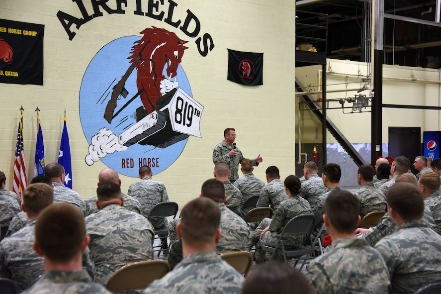 U.S. Air Force Chief Master Sgt. David W. Wade, 9th Air Force command chief, addresses members of the Rapid Engineer Deployable Heavy Operational Repair Squadron Engineers (RED HORSE) during a commander’s call at Malmstrom Air Force Base, Mont., Jan. 25, 2018. During their visit, 9th AF leadership met with 819th RHS, base leaders and Airmen to thank them before they leave for upcoming deployments this spring. (U.S. Air Force photo by Kiersten McCutchan)