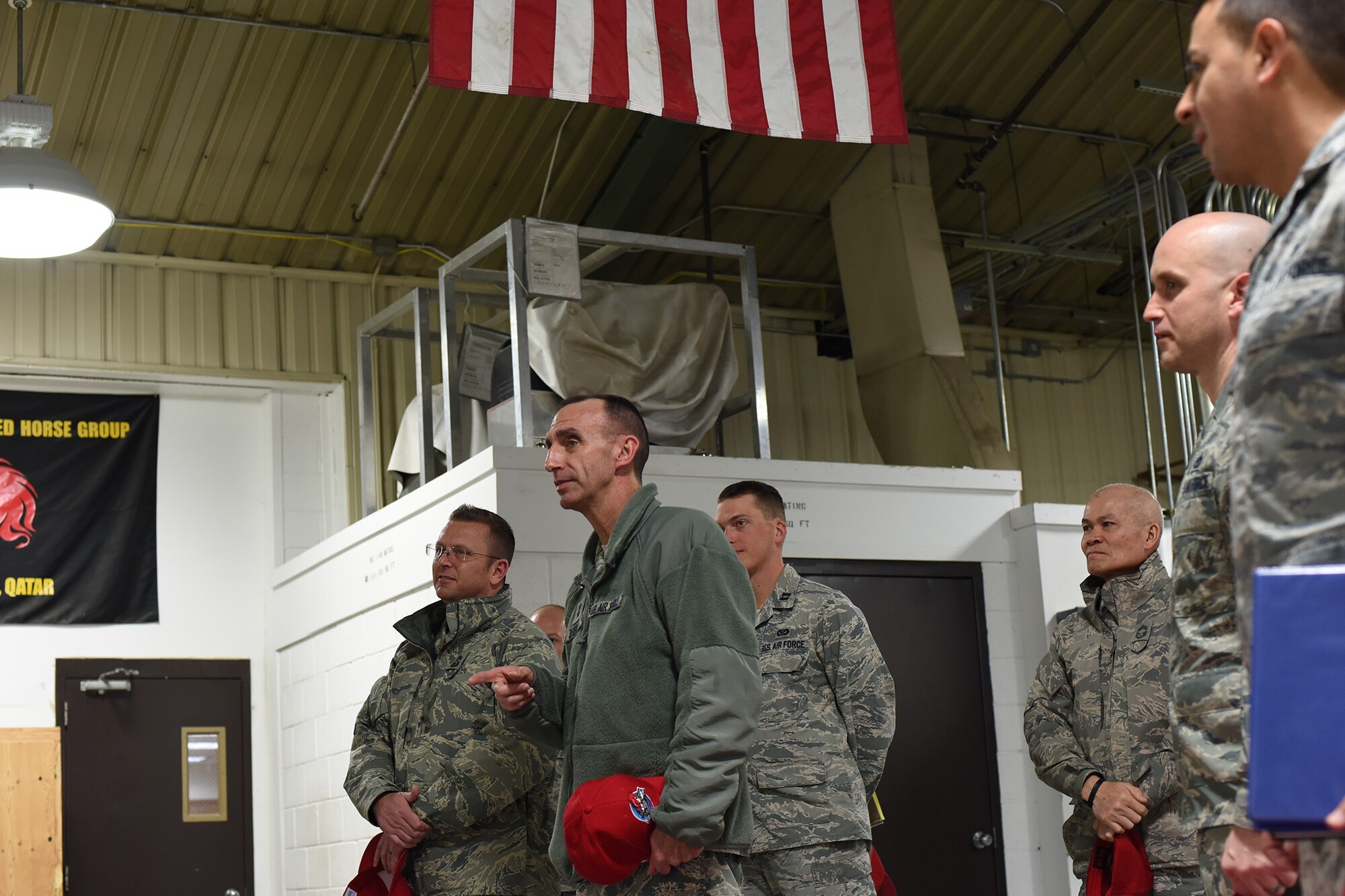 U.S. Air Force Maj. Gen. Scott J. Zobrist, center, 9th Air Force commander, and Chief Master Sgt. David W. Wade, 9th AF command chief, speak with Airmen from the 819th Rapid Engineer Deployable Heavy Operational Repair Squadron Engineers (RED HORSE) cantonments section, at Malmstrom Air Force Base, Mont., Jan. 25, 2018. During their trip, 9th AF leadership met with 819th RED HORSE Squadron, base leaders and Airmen for a mission update and to thank them for their support. (U.S. Air Force photo by Kiersten McCutchan)