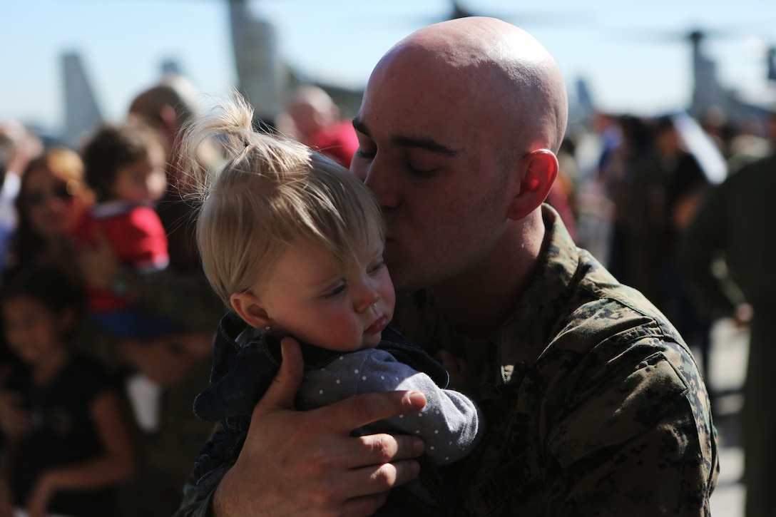 A father reunites with his son following the 15th Marine Expeditionary Unit’s aviation combat element’s return to Marine Corps Air Station Miramar, Calif., Feb. 1. During the deployment, more than 4,500 Marines and Sailors of the America Amphibious Readiness Group and embarked 15th MEU conducted maritime security operations and multiple military-to-military exchanges with partner nations in support of regional security, stability and the free flow of maritime commerce in the Indo-Asia-Pacific and Middle East regions.