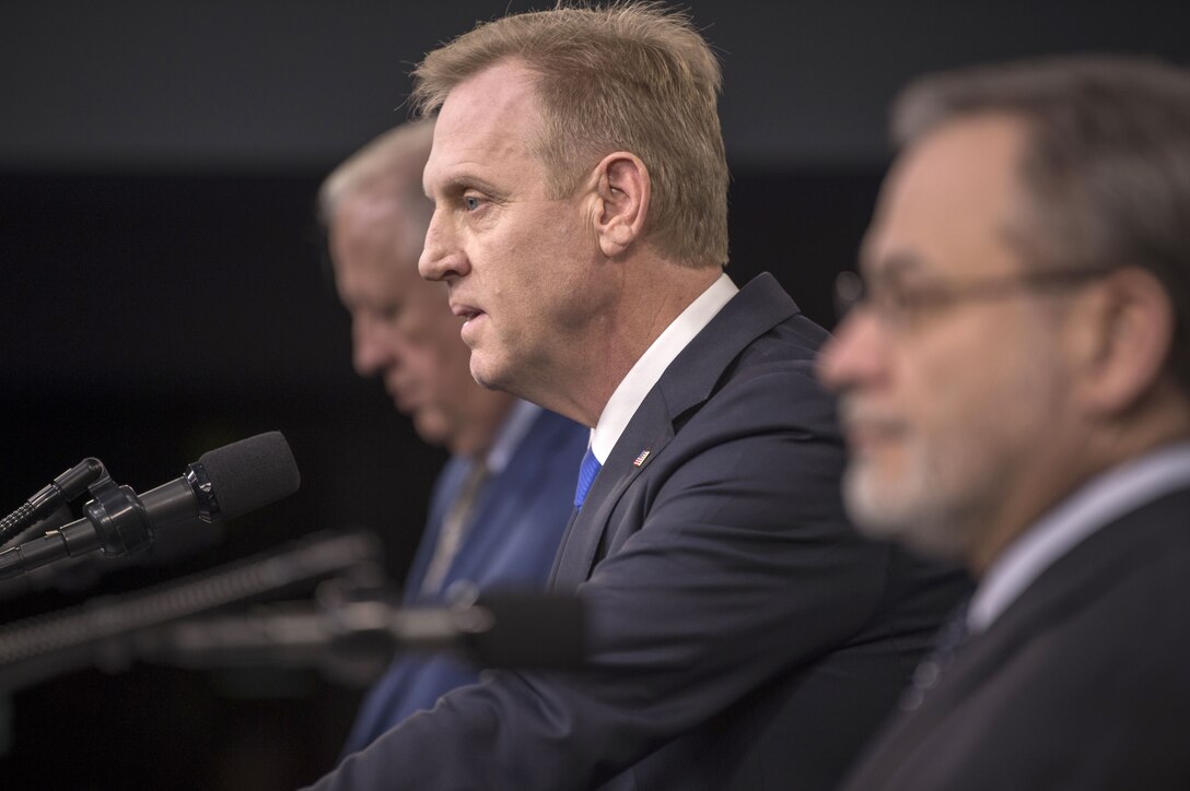 Deputy Defense Secretary Patrick M. Shanahan and two government officials brief reporters at the Pentaon.