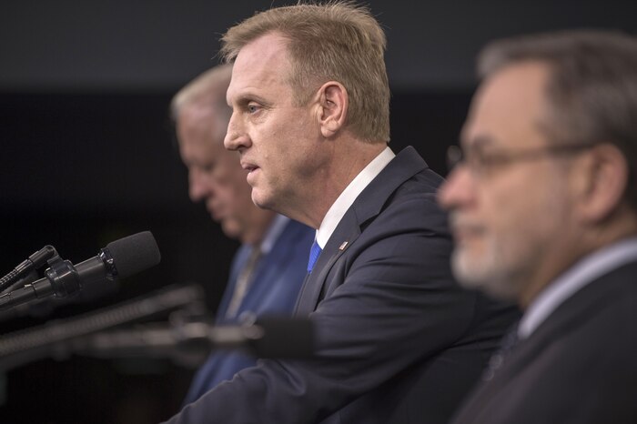 Deputy Defense Secretary Patrick M. Shanahan and two government officials brief reporters at the Pentaon.