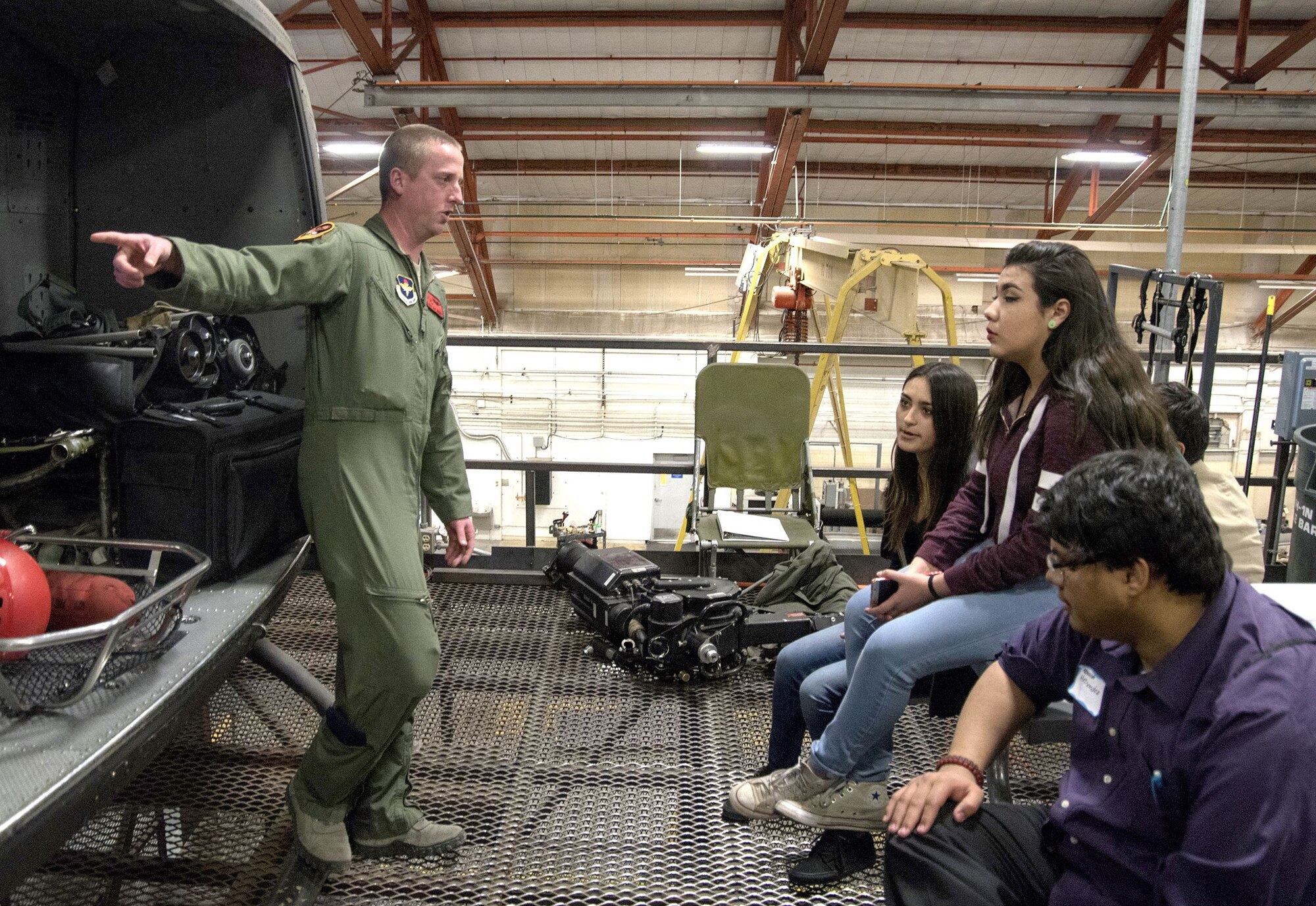Staff Sgt. Eric Jensen, an instructor with the 58th Training Squadron, talks to students from Robert F. Kennedy Charter School in Albuquerque Feb. 1. The students visited several areas in the 58th Special Operations Wing as part of the Junior Achievement Job Shadow Program.
