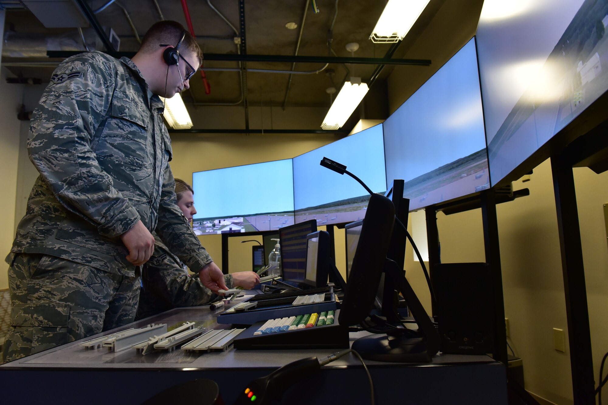 Airmen perform training using simulations in the air traffic control tower.