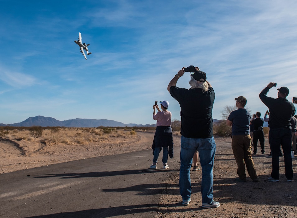 Spectators watch as an A-10 Thunderbolt II flies over the Barry M. Goldwater Range in Gila Bend, Ariz., Feb. 1, 2018. Airspace over Luke Air Force Base as well as the BMGR was used for pilots to contest with one another in basic fighter maneuvers and air-to-surface attacks in an annual competition known as Haboob Havoc. (U.S. Air Force photo/Airman 1st Class Caleb Worpel)