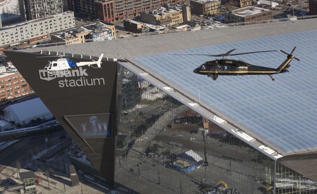 A U.S. Customs and Border Protection, Air and Marine Operations, AStar and a UH-60 Black Hawk helicopter fly over U.S. Bank Stadium in advance of Super Bowl LII in Minneapolis, Minn., Jan. 29, 2018. The Western Air Defense Sector worked with the CBP to enforce the Federal Aviation Administration’s temporary 30-mile radius flight restricted area over the Super Bowl game. (U.S. Customs and Border Protection photo by Glenn Fawcett)