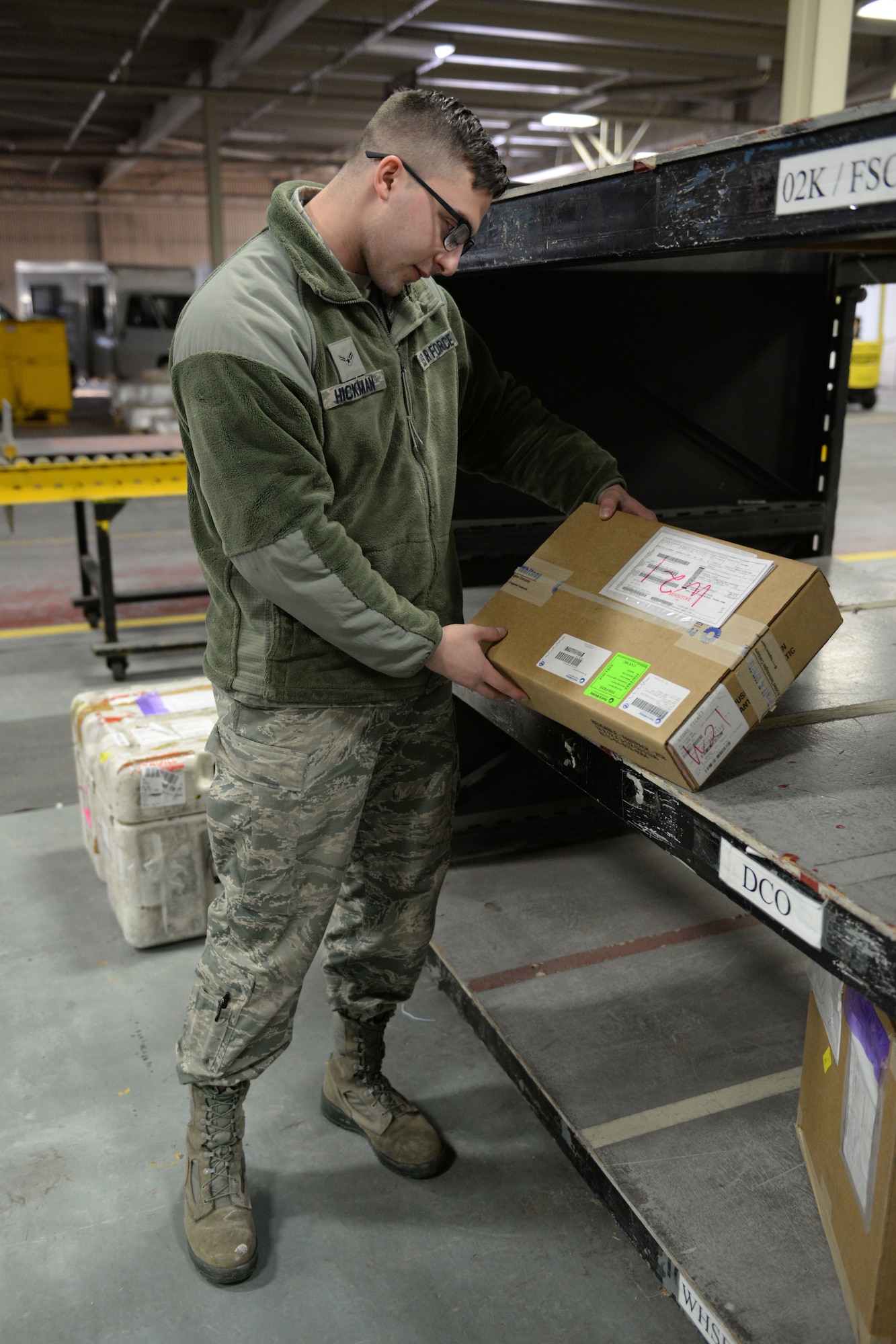 Airman 1st Class Jacob Hickman, a 773d Logistics Readiness Squadron Documented Cargo vehicle operator picks up cargo for his next scheduled delivery Feb. 2, 2018, at Joint Base Elmendorf-Richardson. Documented Cargo establishes the most effective and efficient process to deliver cargo to the customer using scheduled delivery/pick-up sweeps throughout the installation.
