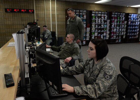 Airmen with the 773d Logistics Readiness Squadron Vehicle Operation Control Center work with customers Feb. 2, 2018, at Joint Base Elmendorf-Richardson, Alaska. The VOCC ensures qualified vehicle operators are available to support all transportation requests. Within the VOCC is an additional area, Operator Records and Licensing, which is responsible for all motor vehicle operator records for military and civilian personnel authorized to operate Air Force - owned, rented or leased vehicles.