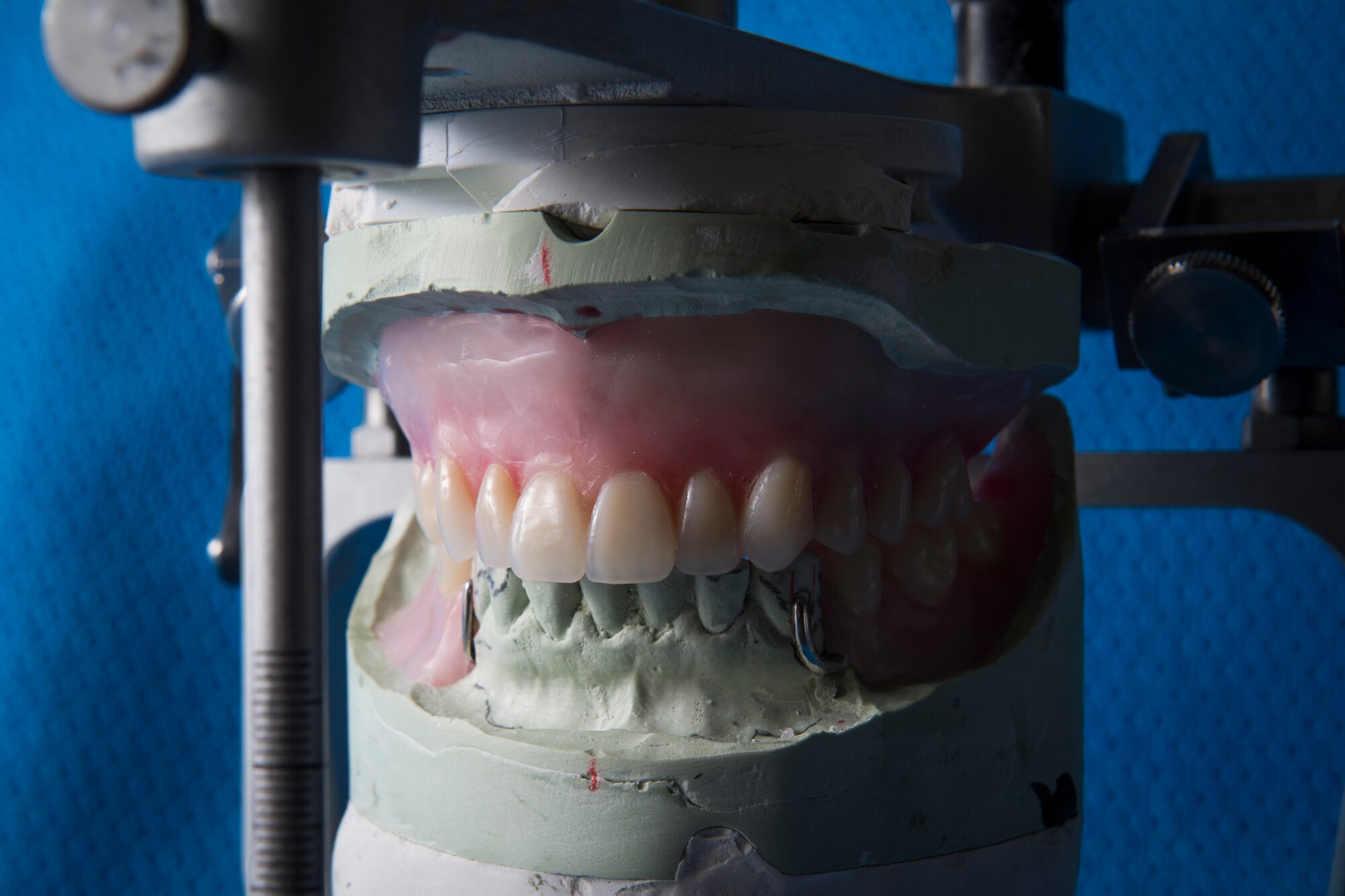 Uncompleted dentures sit in a vise to be worked on by the 374th Dental Squadron’s dental lab, Jan. 29, 2018, at Yokota Air Base, Japan.