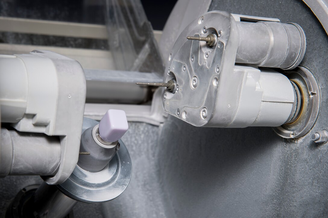 A ceramic core sits inside computer aided manufacturing machine used by the 374th Dental Squadron dental lab to make replacement teeth, Jan. 29, 2018, at Yokota Air Base, Japan.