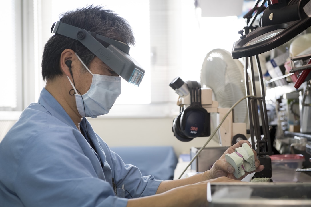 Fujio Ishikawa, 374th Dental Squadron dental lab technician, prepares dental molds, Jan. 29, 2018, at Yokota Air Base, Japan.