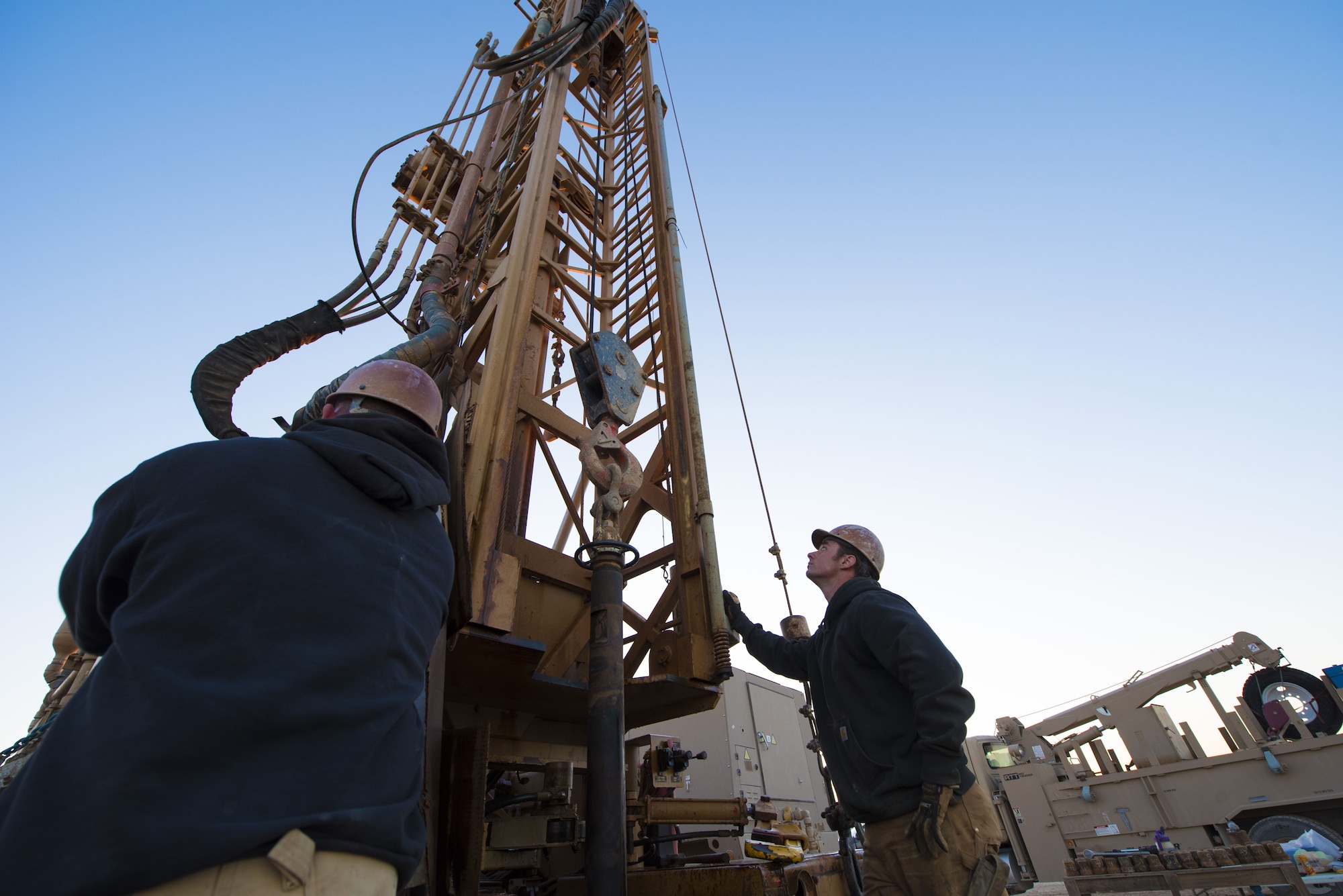 Airmen assigned to the 557th Expeditionary RED HORSE Squadron pull filter screens out of a newly-drilled well January 31, 2018 at an undisclosed location in Southwest Asia. Changing filter screens requires the crew to add and remove hundreds of feet of piping every day. (U.S. Air Force photo by Staff Sgt. Joshua Kleinholz)