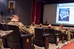 Yokosuka, Japan (Feb. 1) Mr. Cecil Robinson, NAVIFOR CIO1, speaks to Sailors and civilians during the C7F 2018 Cybersecurity & Communications Symposium at the Fleet Theater on Yokosuka Naval Base.