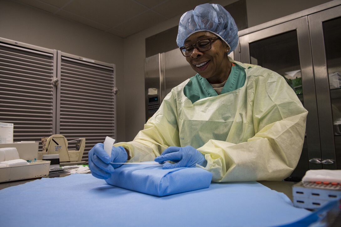 Saundra Pittman, 23d Aerospace Medical Squadron Central Instrument Processing Center (CIPC) technician, wraps dental instruments, Jan. 19, 2018, at Moody Air Force Base, Ga. CIPC technicians are responsible for ensuring all instruments used on patients within the 23d Medical Group are properly sterilized. They wrap the instruments with sensors to ensure the sterilizer reaches proper temperatures and the instruments remain sterile until use. (U.S. Air Force photo by Senior Airman Janiqua P. Robinson)