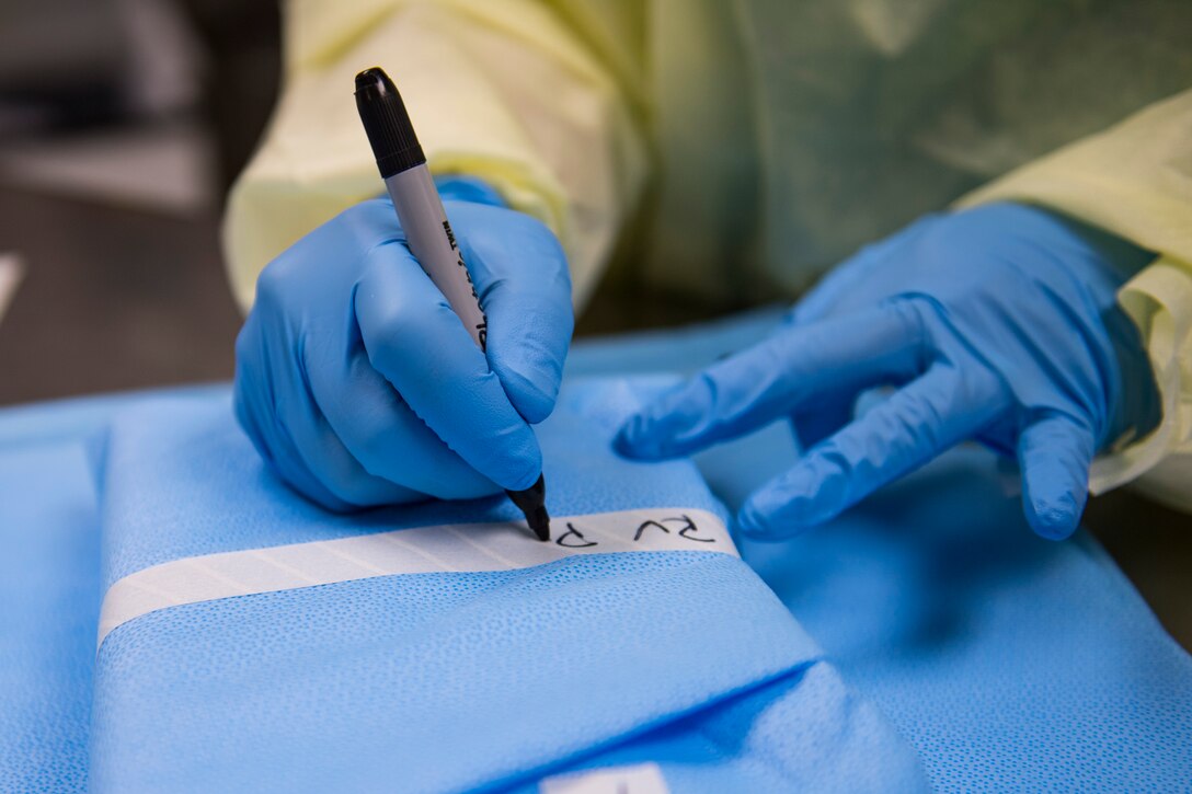 Saundra Pittman, 23d Aerospace Medical Squadron Central Instrument Processing Center (CIPC) technician, labels dental instruments, Jan. 19, 2018, at Moody Air Force Base, Ga. CIPC technicians are responsible for ensuring all instruments used on patients within the 23d Medical Group are properly sterilized. They wrap the instruments with sensors to ensure the sterilizer reaches proper temperatures and the instruments remain sterile until use. (U.S. Air Force photo by Senior Airman Janiqua P. Robinson)