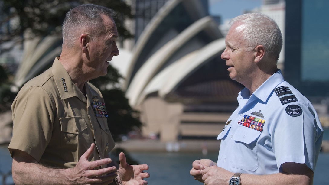 Two military leaders speak together in Sydney.