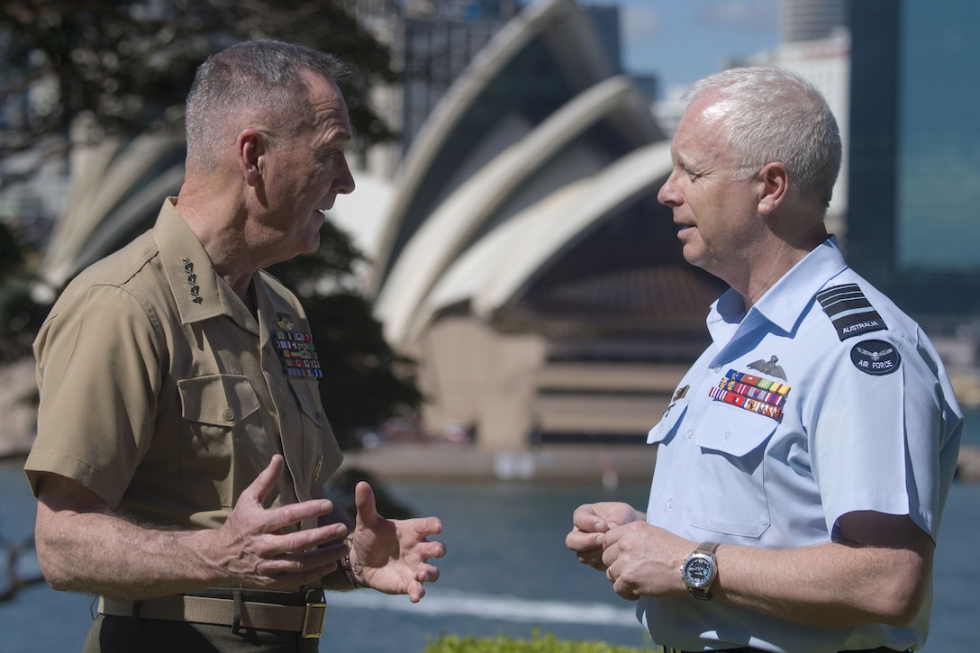 Two military leaders speak together in Sydney.